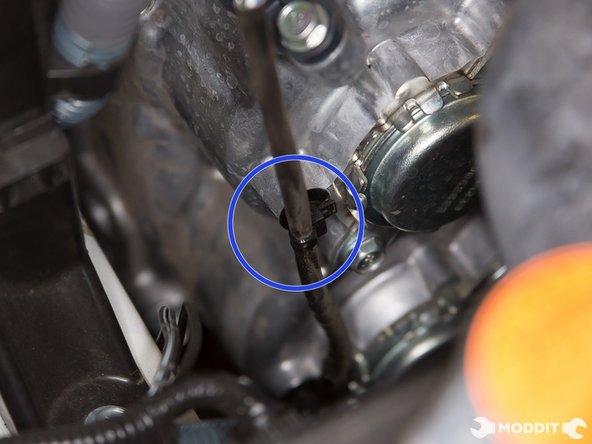 You also need to disconnect the clip securing the o2 sensor wires to the front of the motor.