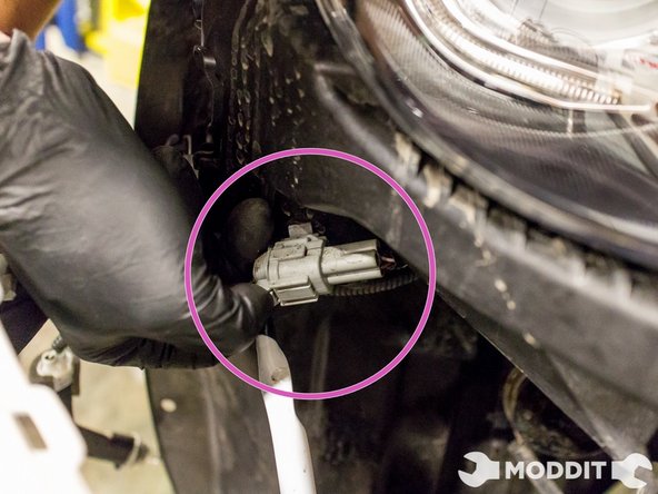 Before completely removing the front bumper however, disconnect the two plugs under the headlights to the fog lights and to the turn signals, on both sides.