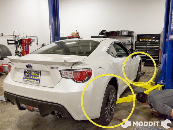 After taking out all of the trunk interior panels, you are ready to get the car in the air. We got the vehicle up in the air with our car lift, then loosened the lug nuts on our BRZ. We mainly used an impact gun for most of the loosening of bolts/nuts, however you can use ratchets and/or wrenches if you don’t have an impact gun.