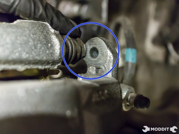 Make sure the flat tabs on the sliding pins line up to the machined ridge of the caliper when you're about to install the caliper.