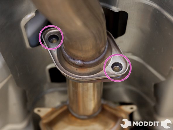 Go ahead and unbolt the junction between the cat and the mid pipe.