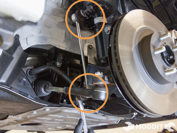 The last small component to remove on the front oem suspension are the sway bar end links. Use a 14mm socket on the nut side and an Allen wrench on the bolt to remove the end links. If you don’t have replacement sway bar end links, then leave the end links on.
