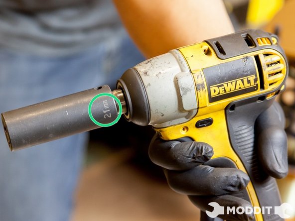 If you too are replacing  the Springs move on to loosen the 21 mm nuts retaining the top hats to the coilovers. Be sure to use a plier or wrench to keep the shaft from rotating when loosening the top nut.