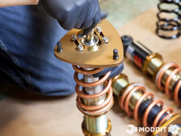 Upon reassembly, we tightened the collars back on until there was no play in the springs, then we tightened it one more turn. There are different preferences in setting preload so feel free to set it to your preferred setting.