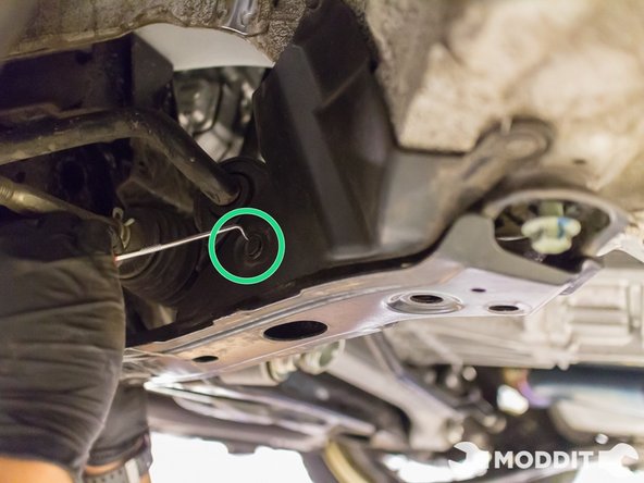 Next remove the 3 plastic clips securing the splash shield located in the wheel well attached to the sway bar brackets.