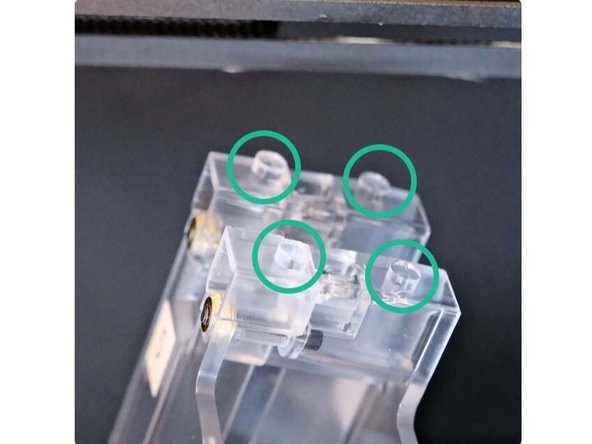Located the four raised cylinders on top of the TS. These will be used to align with the XY plate in subsequent steps.
