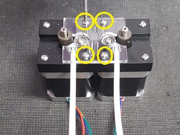Once you've disconnected the motors, remove the 4 screws on the acrylic plate which holds the two motors.