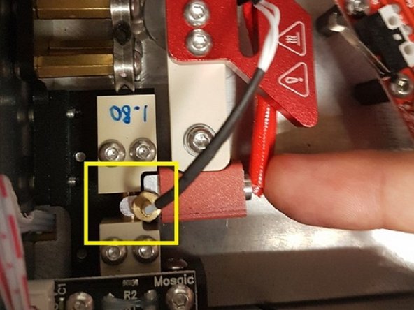 Re-install hot tool arm. When tightening the hot tool screw, press the hot tool against the splicing tube to ensure a good fit. To check if this is installed properly, the hot tool should fully enclose the splicing tube and have very little friction when moving back and forth. Run Splicer Distance (found under Calibration) afterwards.