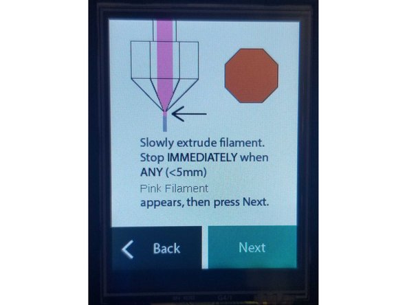 Jog the filament through your extruder until the new colour appears. The clear filament you loaded previously will eventually change to the colour from Input 1. Stop extruding as soon as you see any hint of the filament from Input 1 appear, and confirm loading is complete on Palette's screen by selecting Next.