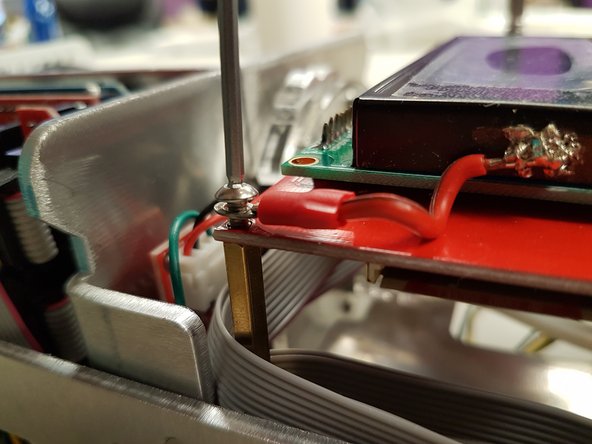 Once the belt is secure, replace the screen portion.  Please be sure to screw the wires to the top-left corner of the screen portion.