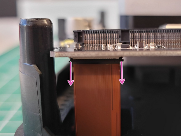 With your new screen, guide the copper ribbon through the substructure in order to connect it and refasten the tab.