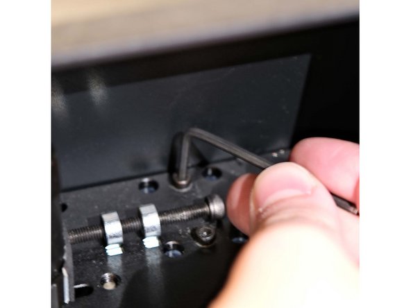 While holding the Transition System, use a 2.5mm hex to loosen and remove the fasteners, setting them aside for later use