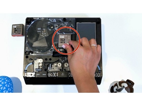 Rotate the thumbscrew counter-clockwise to loosen the splice core and remove it.