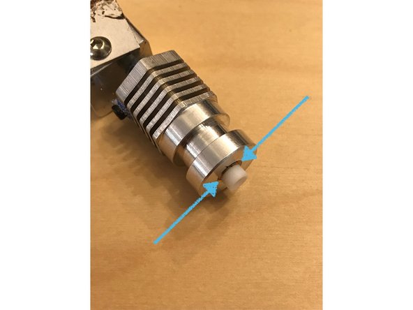 Push the lower PTFE sleeve into the hot end and ensure that the top cap of the PTFE sleeve makes direct contact with the top of the hot end.