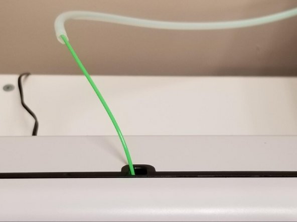 Load filament into the inputs, making sure not to use clear or transparent filament for any inputs as this will be used later in the calibration process. Allow Palette 2 to output filament with the outgoing tube disconnected.