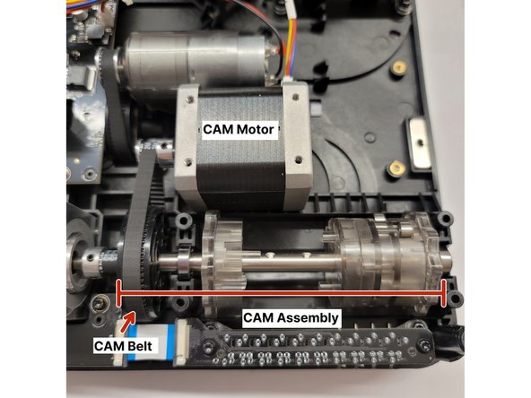 Before reassembling the end caps for the CAM, place the CAM back in its position like the photo shown. The black CAM disc and CAM belt will be pointed towards the left.