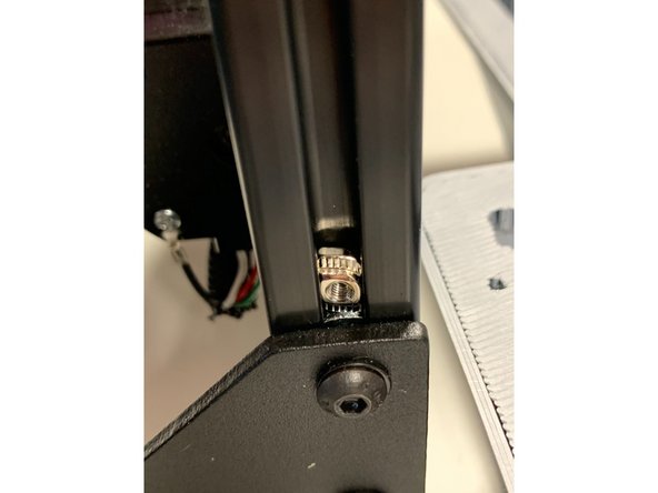 Tighten both screws ensuring that the plate is level and flush to the extrusion.