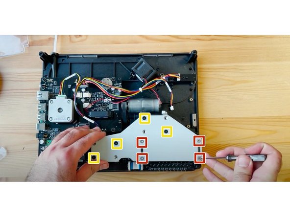 Place the CAM support bracket back, aligning with the tabs on the endcaps.