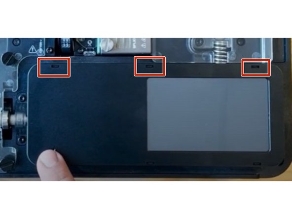 Remove the screen cover by lifting it using these tabs.