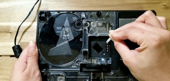 Hold the reset button, then turn the power switch on. Once Palette is on (you'll see the internal lights turn on), release the reset button. The screen itself may remain off and dim.