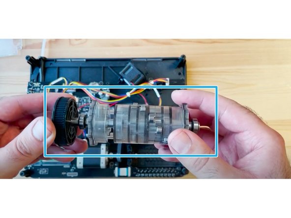 Hold the substructure in place by holding it against a flat surface, to secure the CAM spring while removing these 4 screws.