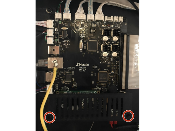 Use a 2mm Hex/Allan tool to remove the two screws holding the shroud to the mainboard