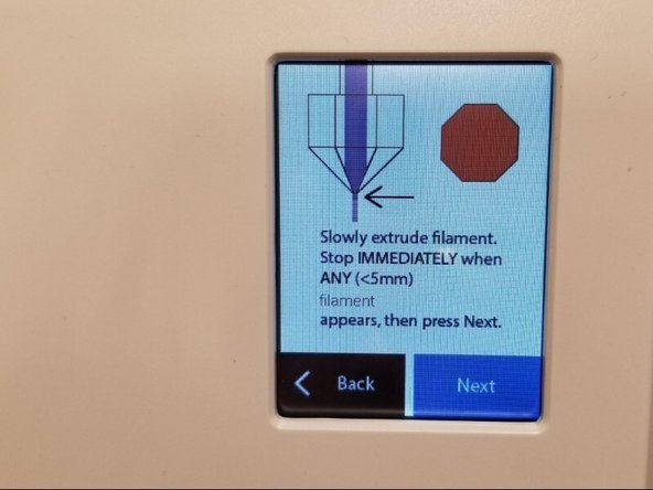 On the Ultimaker screen select Maintenance &gt; Advanced &gt; Heat up Nozzle &gt; Scroll to 210C. Wait until the temperature reaches 210C. Caution: the nozzle will be very hot through the next few steps.