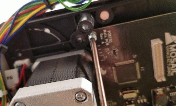 Place the blue and white ribbon cable back in place (gently insert until it's level and can no longer go further) and push down the sides of the clip to hold in place. Re-tighten the screws on the main board.