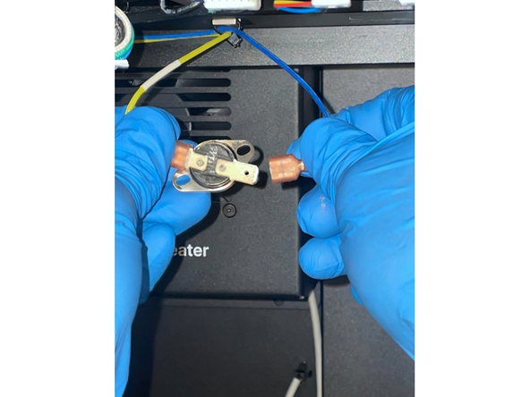 Remove one connector from the Snap Disc by lightly shifting the connector up and down while tugging away from the Snap Disc