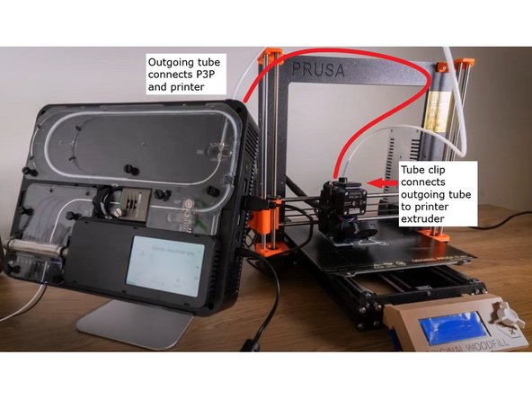 The purpose of the extruder clip is to connect Palette's outgoing tube directly to the printer's extruder. This tube clip and outgoing tube keeps the filament production and delivery to the printer as consistent as possible, to help maintain calibration. Note: This photo shows the tube/clip installation while a print is in progress