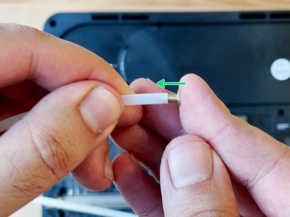 Place the brass retainer end into the gap by the outgoing drive. Reinstall the collet and slowly re-align the tube into the grooved and fastened areas. Snap the tube back into place, following along the buffer area and towards the scroll wheel.