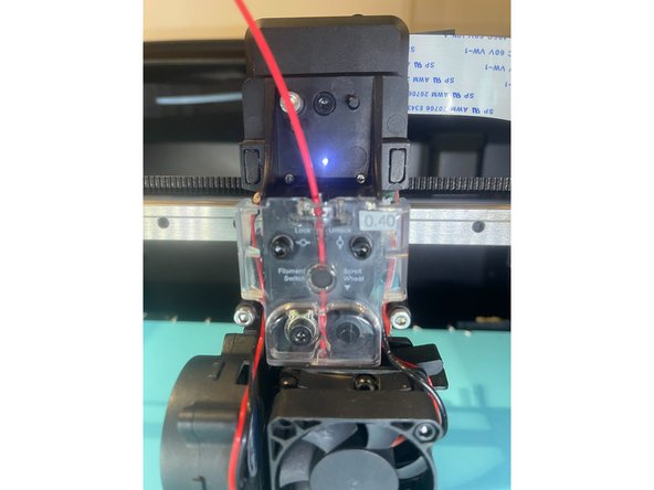 Insert a piece of filament into the Print Head and check the sensor status. If the status does not correspond properly, please follow the steps in our Print Head Disconnection article and contact support@mosaicmfg.com