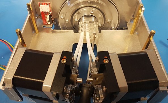  Remove the drives from the front plate. Carefully bring the acrylic plates and drives inside your Palette, and replace the two screws back onto the cutter wheel unit.  