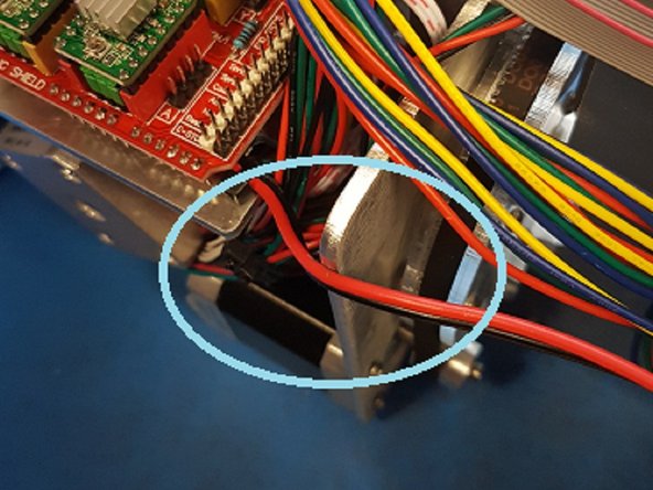 Once everything has been cleared, replace the acrylic plate and tubing to the motors. Hand-tighten the screws but be carefully not to overtighten as this will crack the acrylic. Please note the orientation of the acrylic pieces, as the acrylic plate should be flush with the motors after assembly.