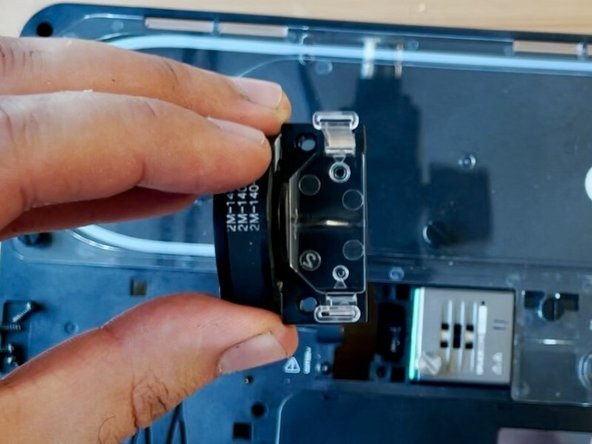 Place the old cutter belt onto the new cutter wheel assembly, before returning back into the unit.