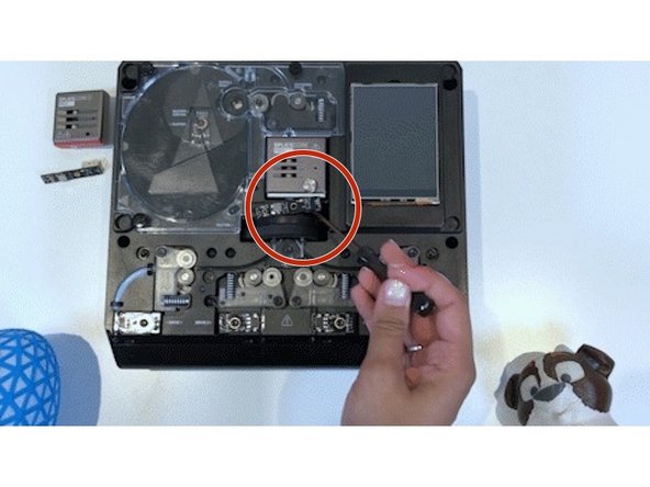 Rotate the cutter wheel to the left until the bottom-middle tab of the acrylic homing switch cover is visible, and not covered by cutter wheel’s blade cover.