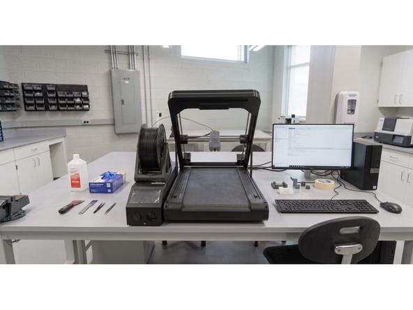 Unpack the Orion printer and place it on a flat, sturdy table in a well-ventilated area.