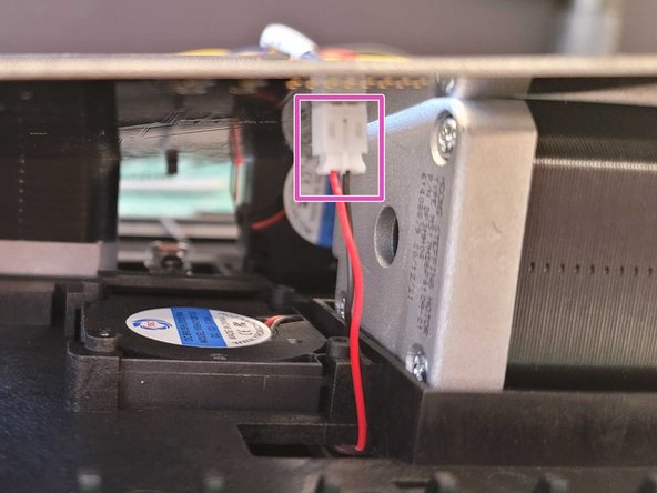 Reconnect the screen ribbon cable and screen fan from underneath the main board.
