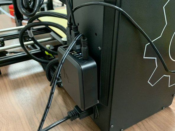 Follow the instructions provided in the manual with the Canvas Hub. It is recommended to mount the Canvas Hub using the provided velcro tabs to the back of the printer so that it is out of the way of the filament. It is also recommended to bundle the wires above the Canvas Hub to ensure that they are tidy and out of the way of any moving parts.