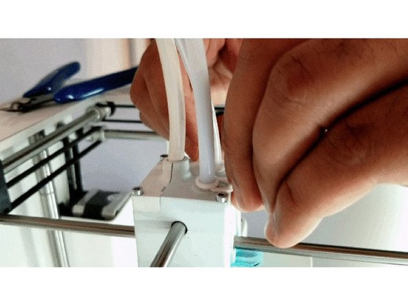 Once the print core indicates it has reached 200C, find 20-30cm of clear PLA. Manually press this down into the print core from the top of the print head until you have purged any remaining material which was in the print head. Pull the filament you just inserted back out before proceeding to the next step.