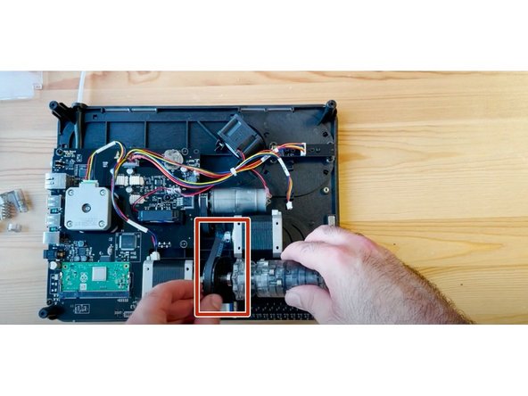 Remove old CAM belt, and place the new belt around the motor and CAM black disk.