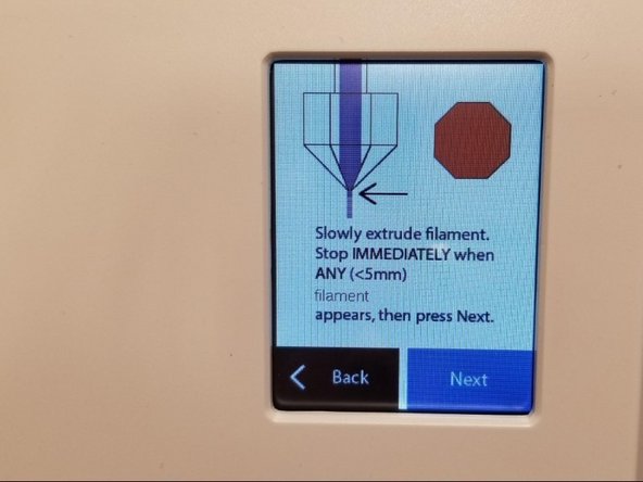 On the Ultimaker screen select Maintenance &gt; Advanced &gt; Heat up Nozzle &gt; Scroll to 210C. Wait until the temperature reaches 210C. Caution: the nozzle will be very hot through the next few steps.