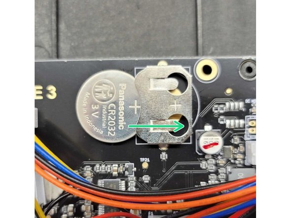 Remove the battery from the old main board, and insert into new main board. Insert the battery so that the (+) is on the right, and matches the position of the (+) symbol in its slot.