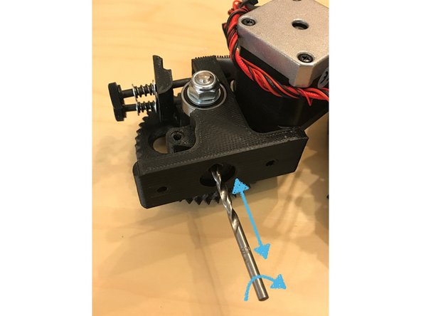 Note: a drill should NOT be required to perform this deburring process. If the PTFE tube does not fit easily into the channel, gently pass the deburring bit into the channel and use your fingers to rotate the bit. Do not to press the bit into the channel too far, or it may damage your metal drive gear. 