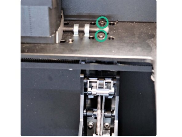 Locate the two fasteners on the XY plate, pictured here.