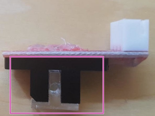 Remove the 2 screws on top of the Opto Sensor.