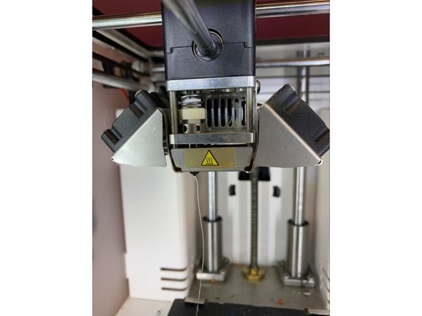 Press the bowden tube back into the print head and replace the lock clip. It is critical to ensure that the bowden tube has been inserted as deep as it can go in order to effectively restrain the Teflon tube in the print core.