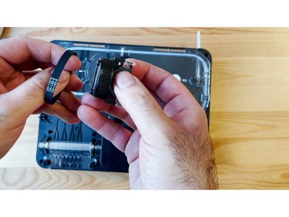 Place the old cutter belt onto the new cutter wheel assembly, before returning back into the unit.