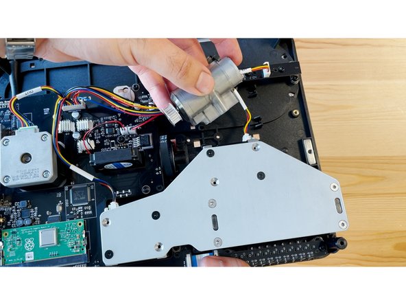 Flip the substructure over, and remove the cutter motor from its position. Keep the motor wiring plugged in.