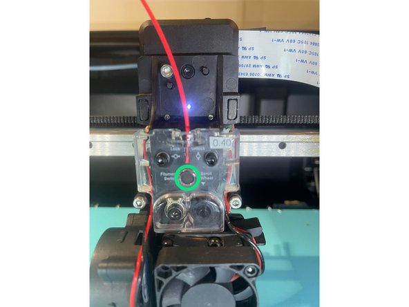 The sensor is located below the acrylic cover, labelled 'Filament switch'